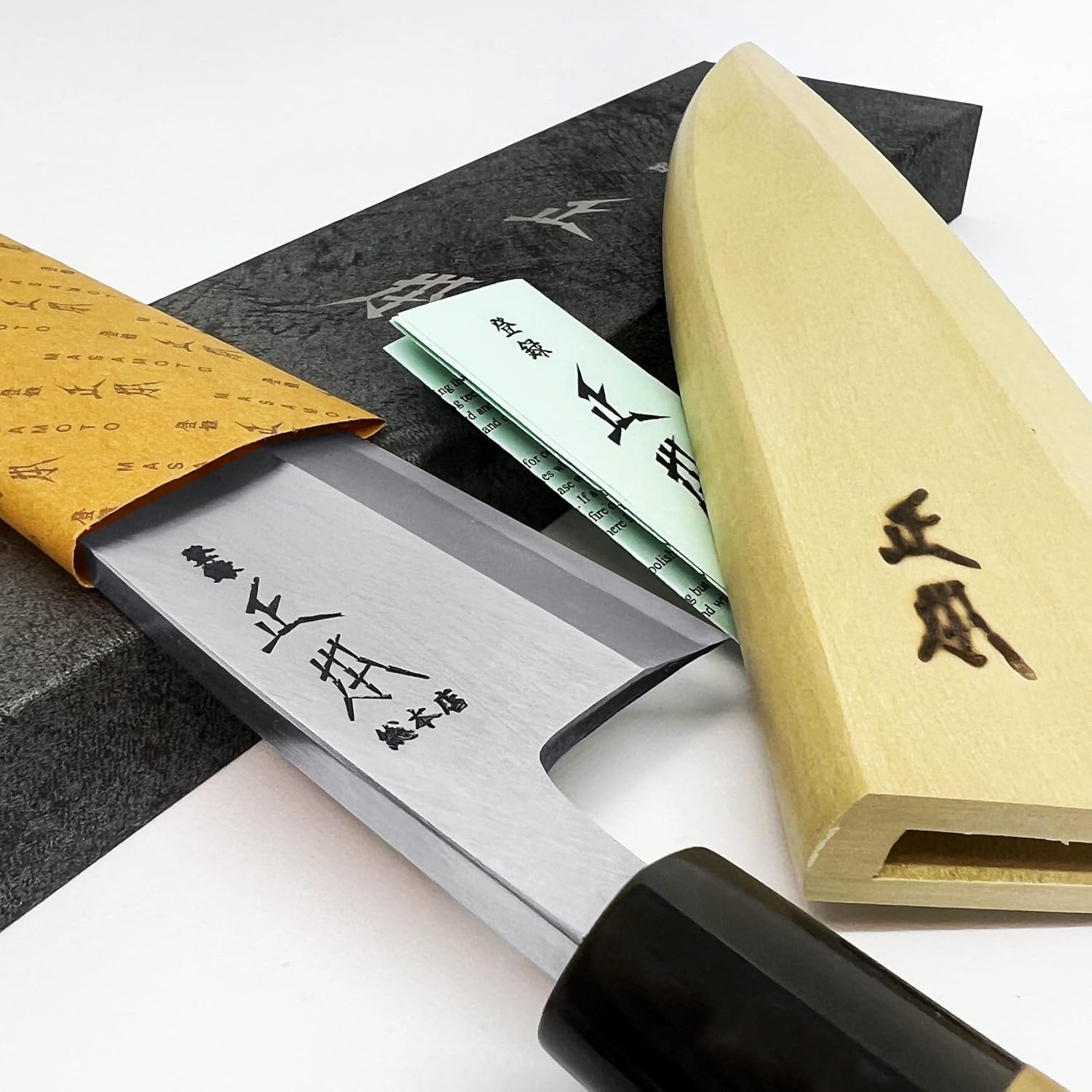 Masamoto KS deba blade detail showing the single-bevel grind and Masamoto mark
