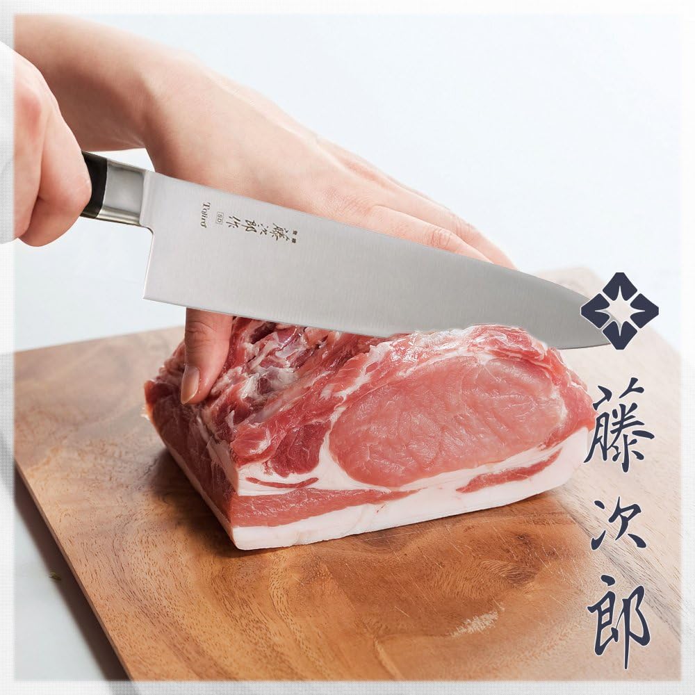 Tojiro DP Petty trimming a pork loin on a cutting board
