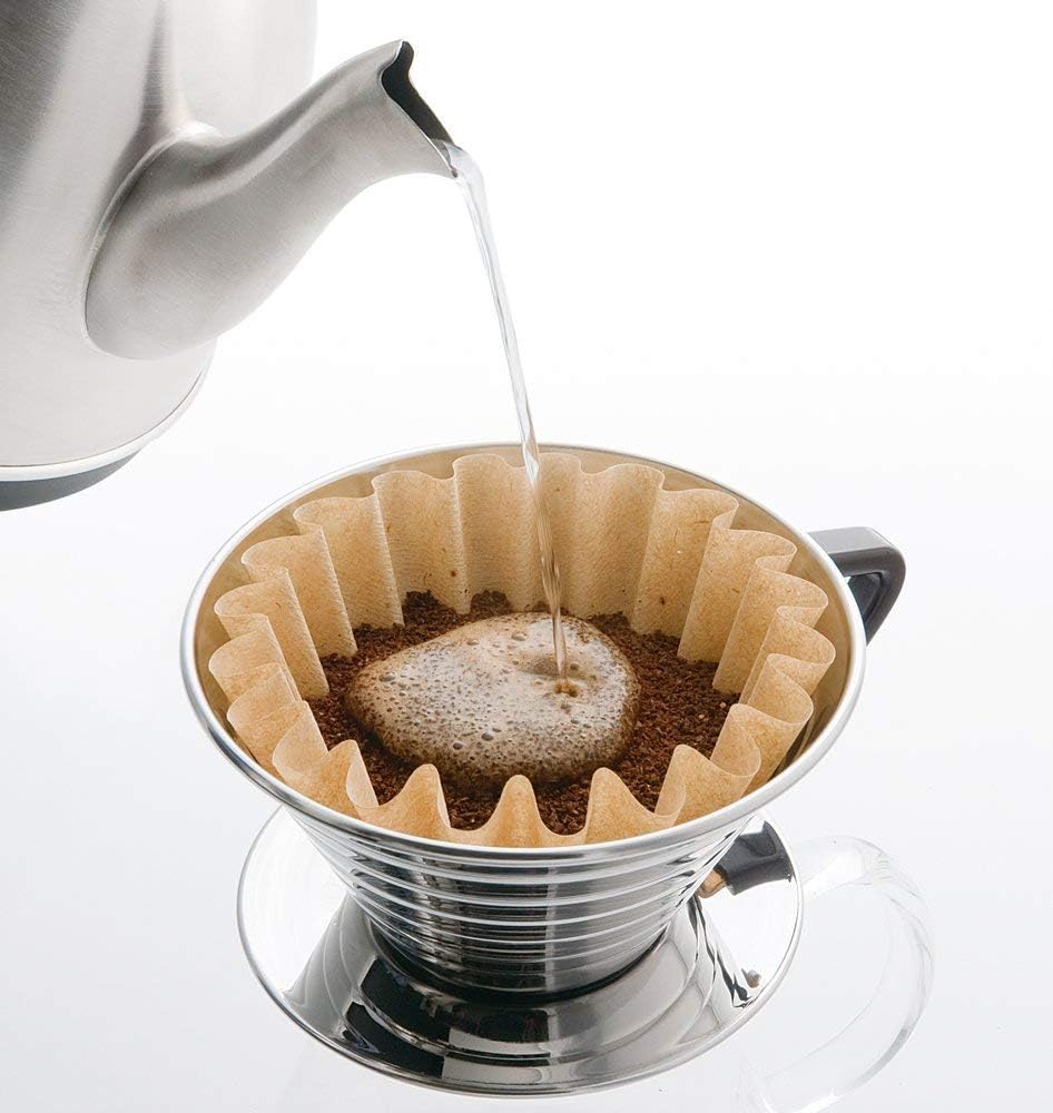 Pouring hot water into a Kalita Wave dripper as the coffee bed blooms