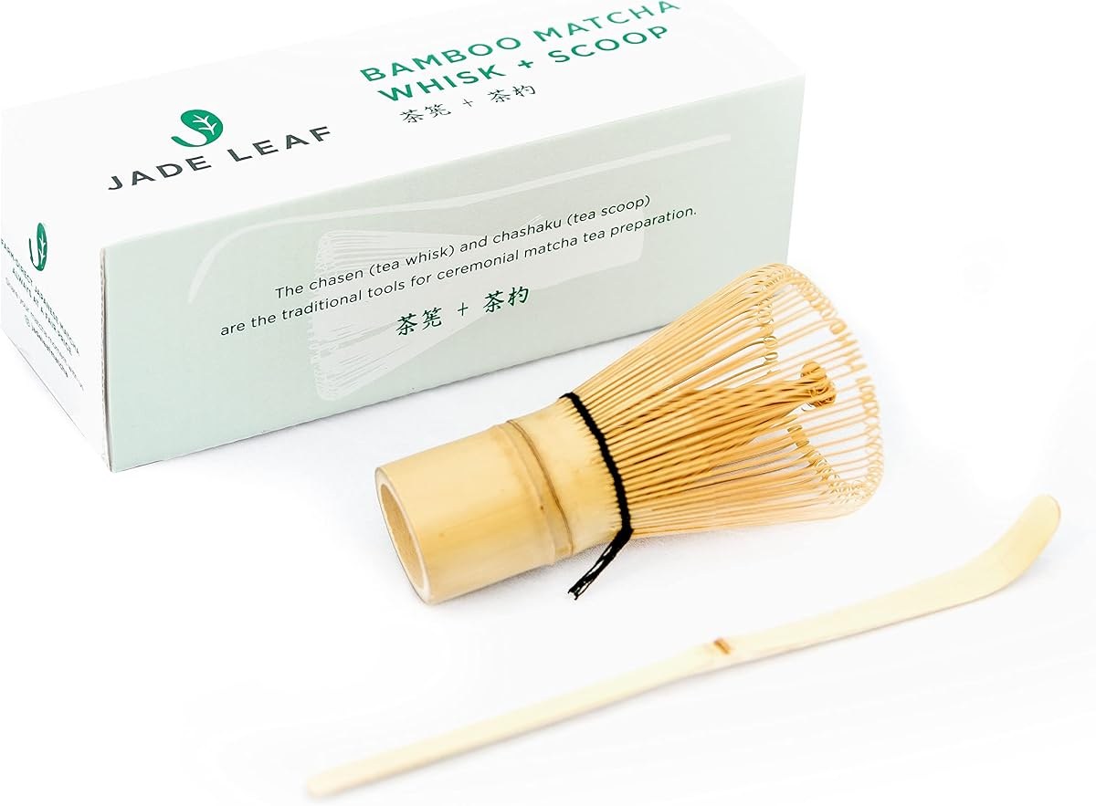 Jade Leaf bamboo matcha whisk with bamboo scoop next to its white retail box
