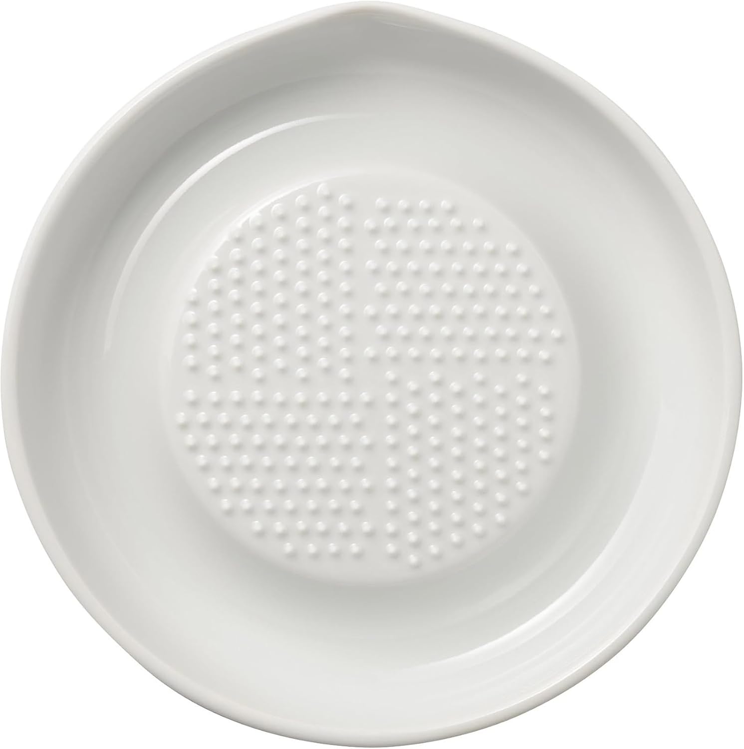Kyocera CD-18 white ceramic grater plate seen from above showing a circular field of conical teeth