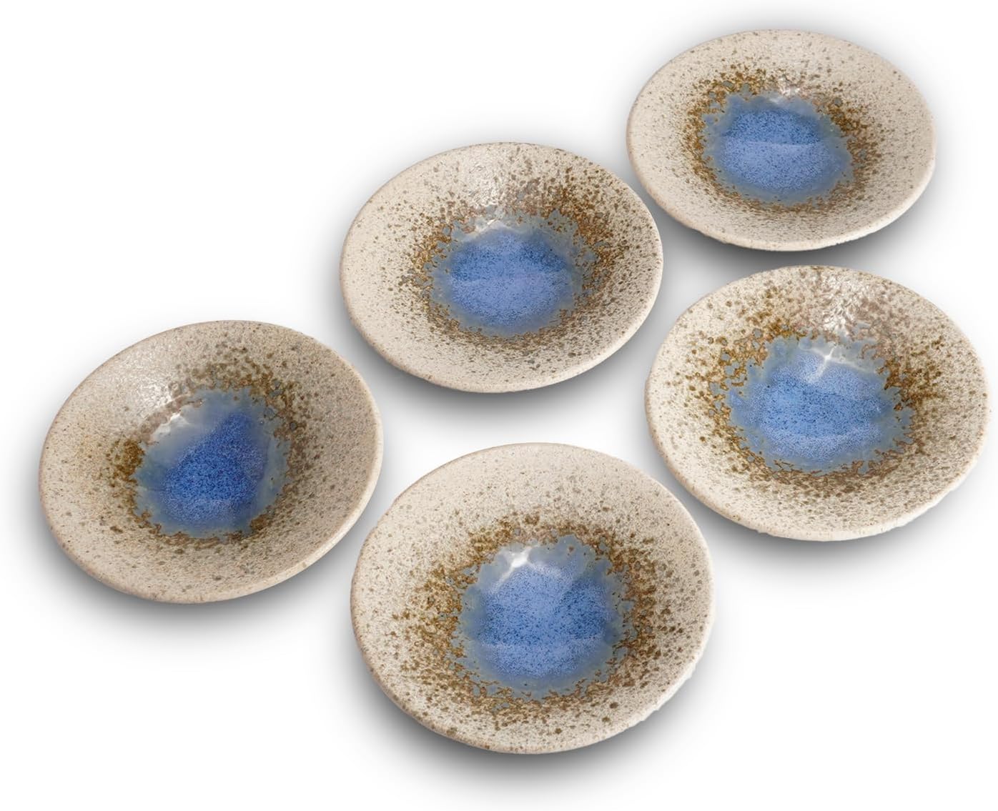 Five speckled Mino ware plates with a pooled blue glaze in the center