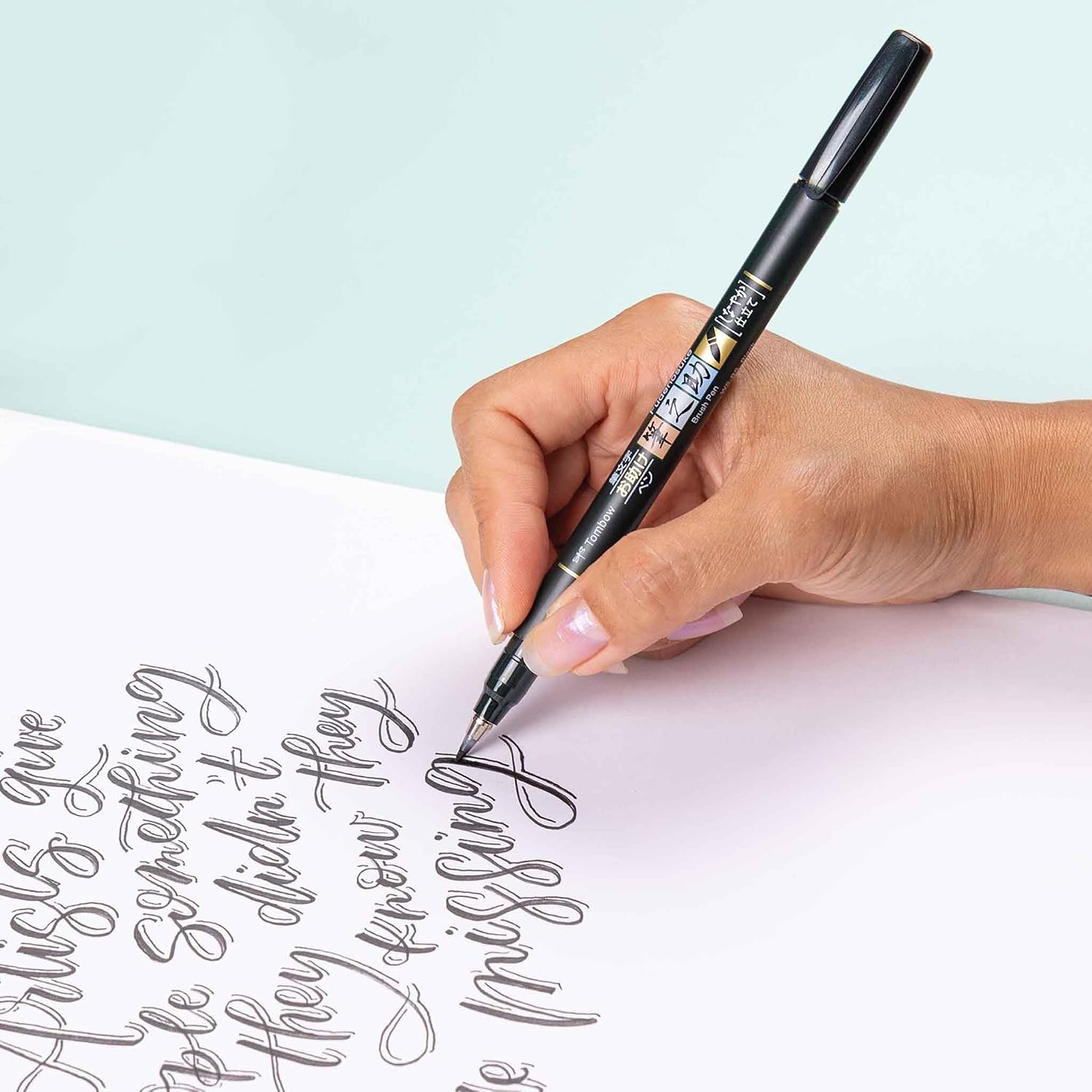 Hand lettering a quote with a Tombow Fudenosuke brush pen