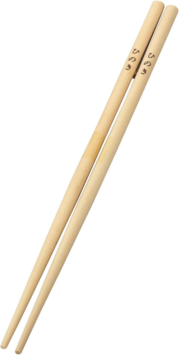 A single pair of hinoki saibashi showing the straight grain and tapered tips