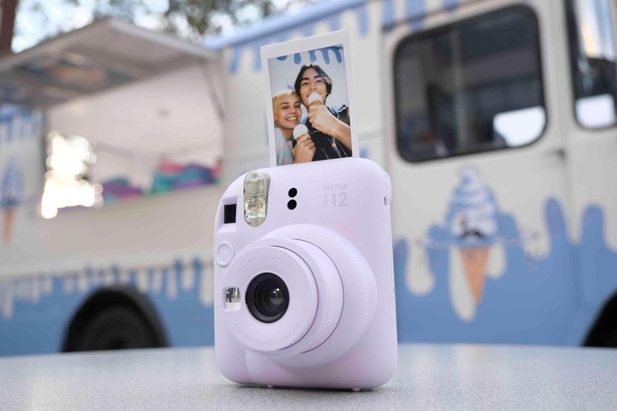 instax mini 12 on a table outdoors with a fresh print