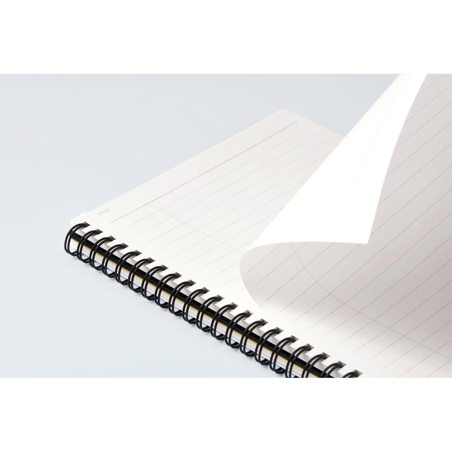 Open Maruman Mnemosyne spiral notebook showing ruled white pages