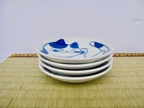 Mino ware cat plates stacked on a tatami mat