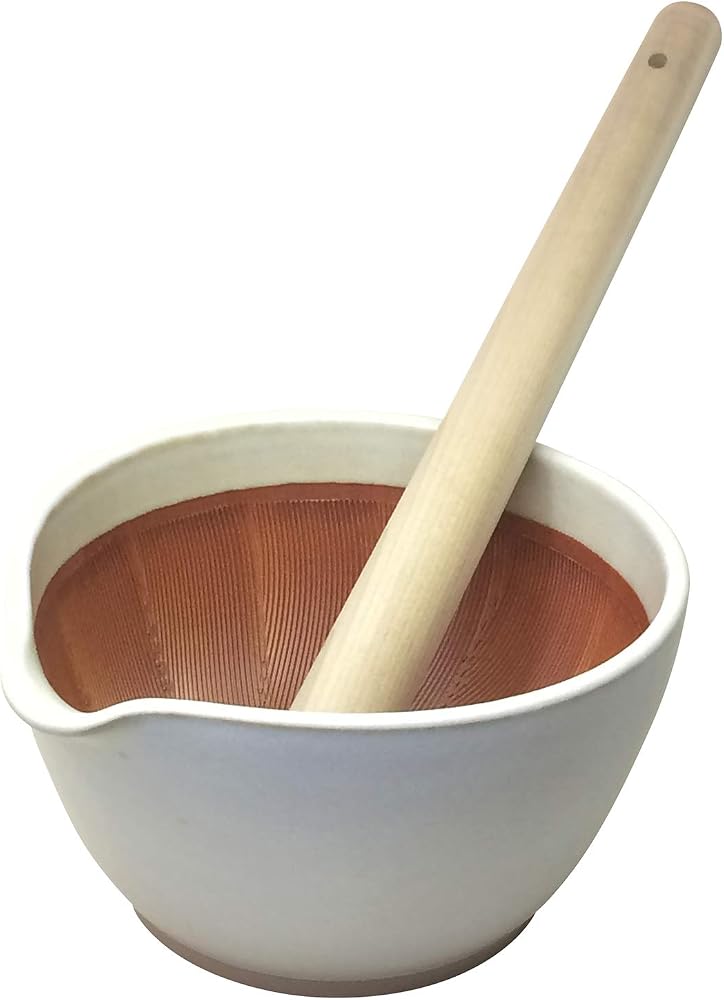 White Motoshige Seitosho suribachi with a red-brown ridged interior, a small pouring lip and a long wooden pestle