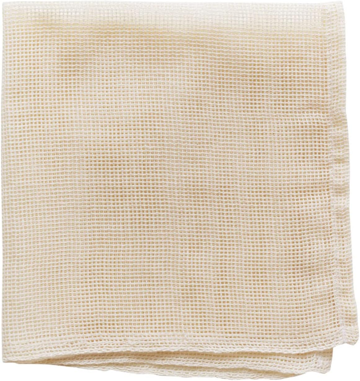 Folded white open-weave cotton steamer cloth by Nichinichi Dogu