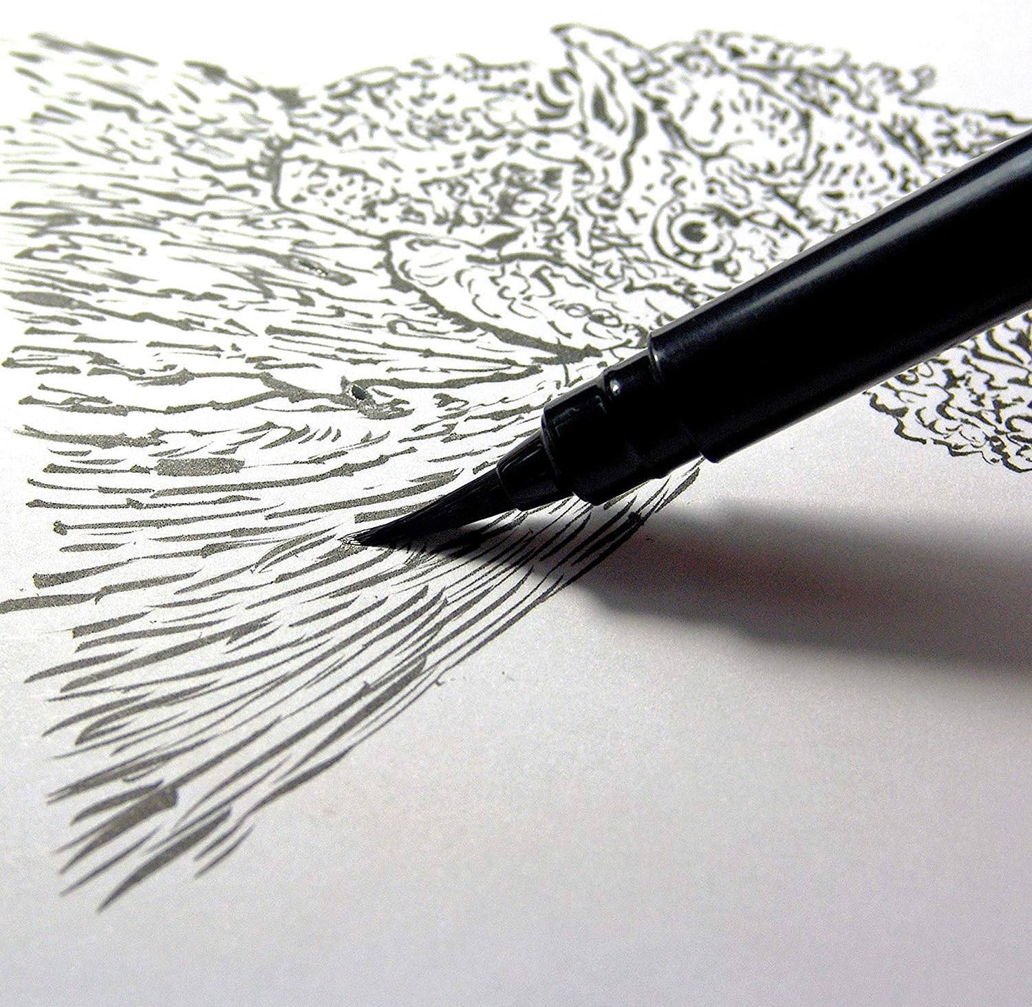 Pentel Pocket Brush Pen inking fine hatched lines on paper