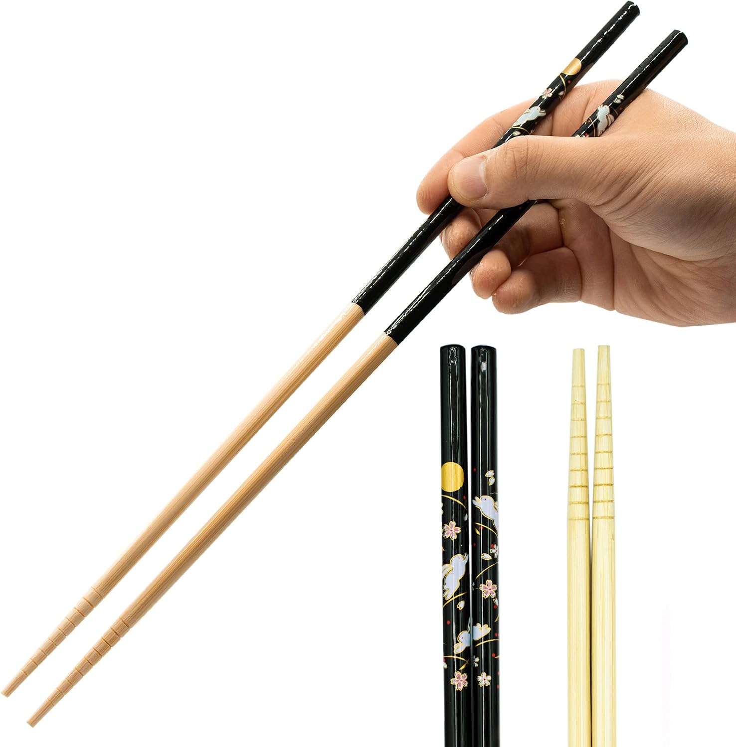 A hand holding the black Tanaka Hashi bamboo saibashi next to a shorter dining pair for scale