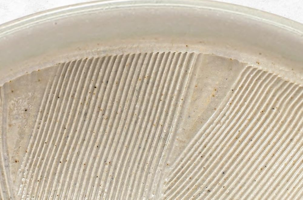 Close-up of the fine comb-pattern ridges inside a TIKUSAN ceramic suribachi