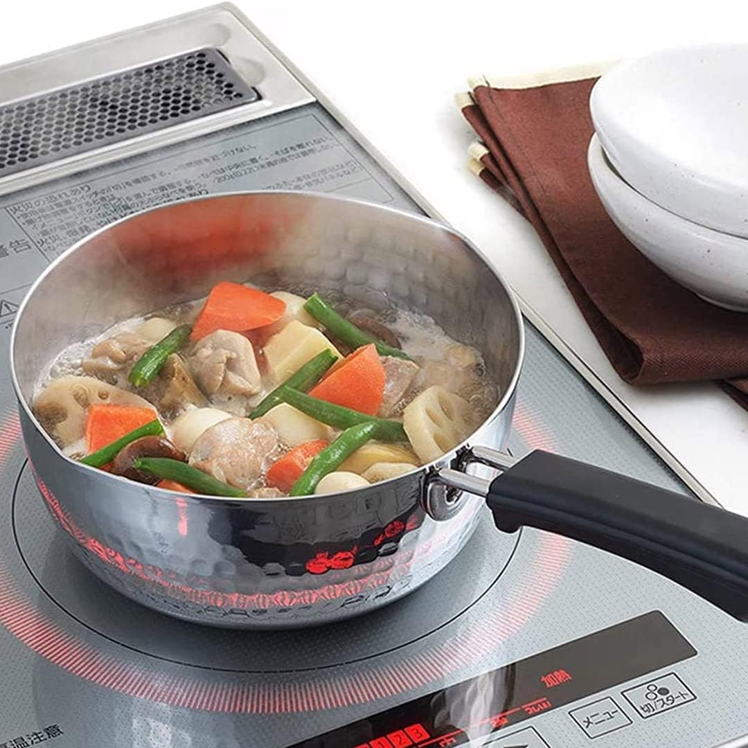 TIKUSAN yukihira pot holding simmered chicken and vegetables on an induction hob