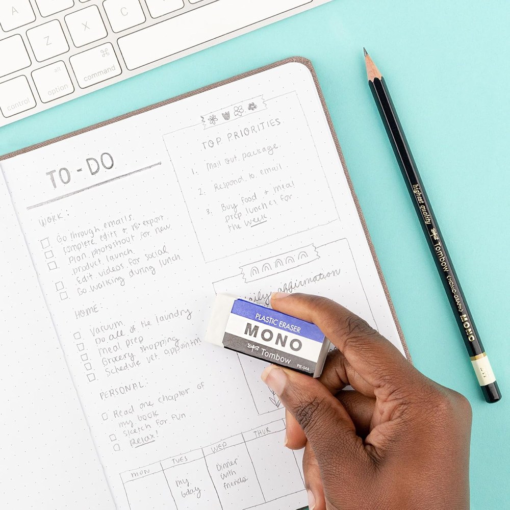 Erasing a pencil to-do list in a notebook with a Tombow MONO eraser